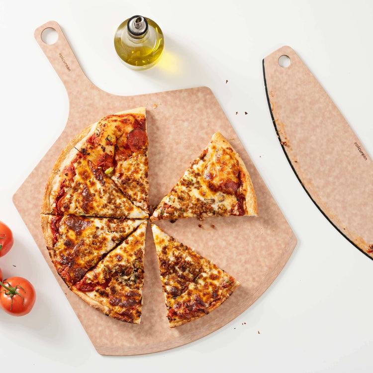 Epicurean Pizza Peel & Pizza Cutter Combo in Natural with a delicious homemade pizza which has been sliced and enjoyed