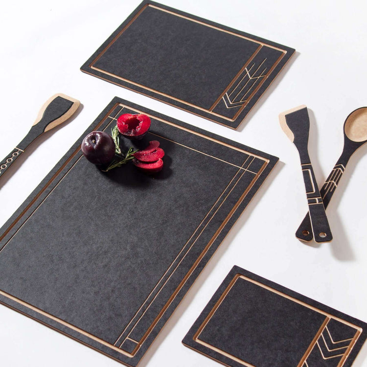 The Frank Lloyd Wright Collection featuring Cut and Serve Small, Medium and Large Boards, Saute Tool, Large Spoon & Paddle in Slate/Natural