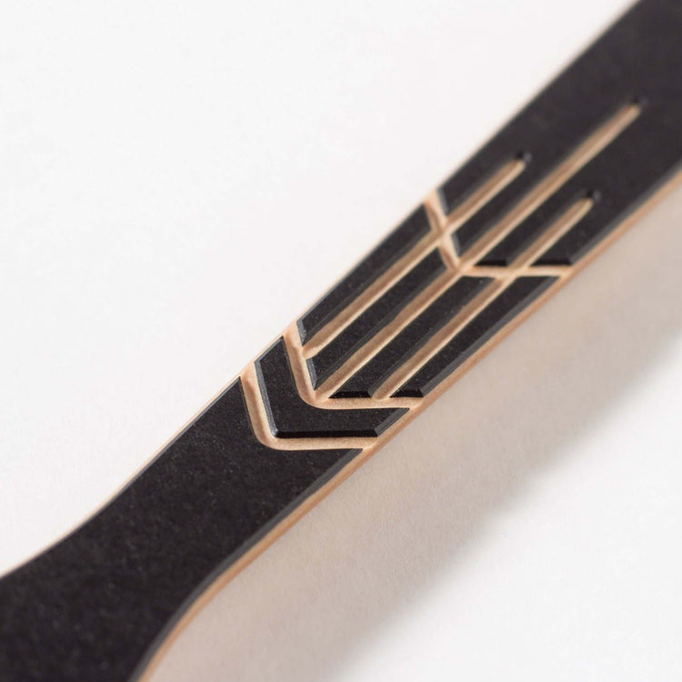 The Frank Lloyd Wright Utensil Set includes the Large Spoon, Paddle and Sauté Tool in Slate/Natural this is a close up detail of the spoons design